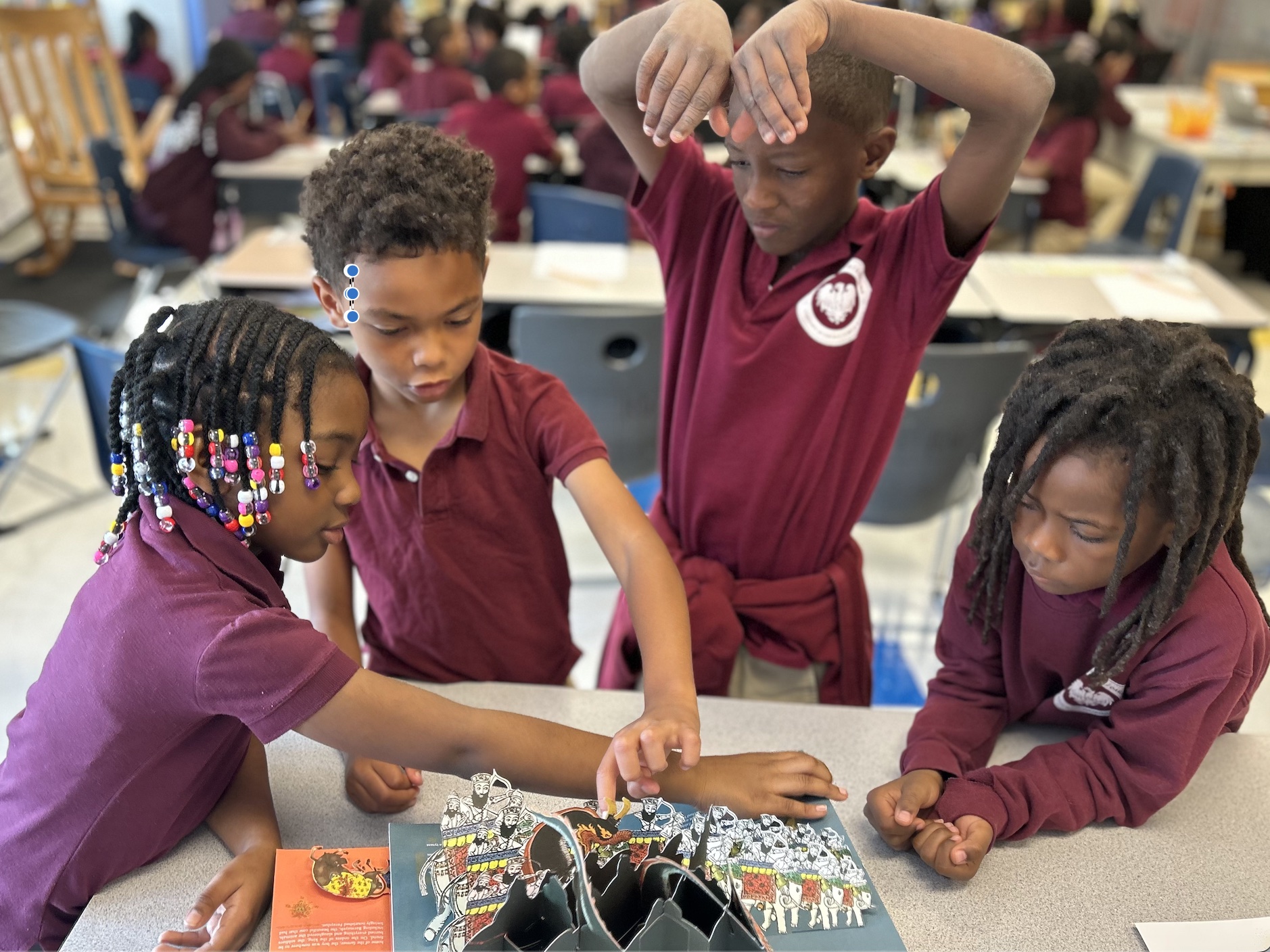 Elementary school children with pop-up book